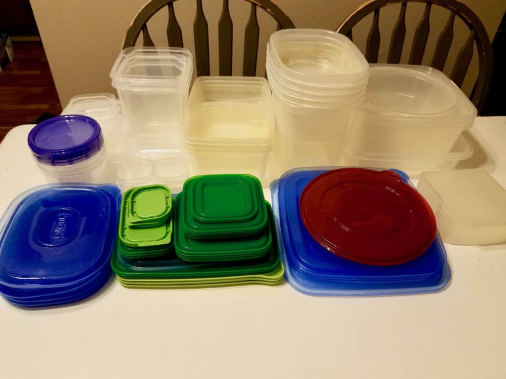Is your tupperware storage a hot mess? How does it get unorganized so quickly?  Keep reading to find 4 simple steps to get it back on track in less than 20 mins! Tupperware Organization has never been so easy! | We Three Shanes