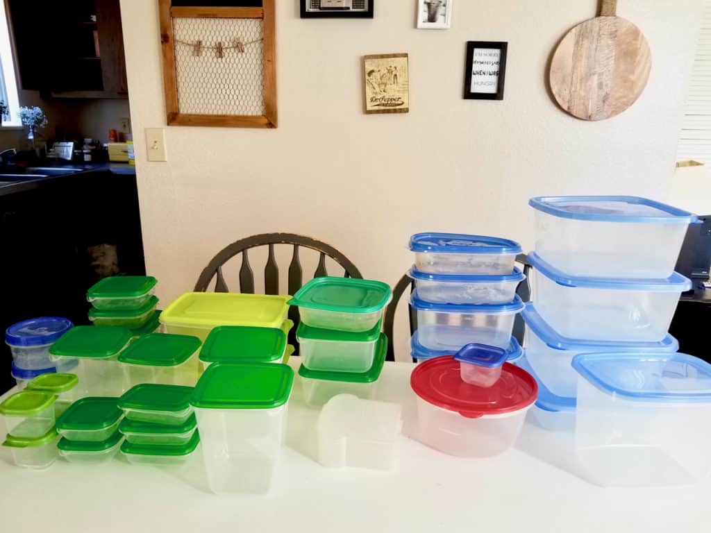 Is your tupperware storage a hot mess? How does it get unorganized so quickly?  Keep reading to find 4 simple steps to get it back on track in less than 20 mins! | We Three Shanes