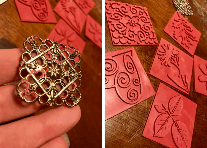 Rubber stamps laid out on a dark wood table.