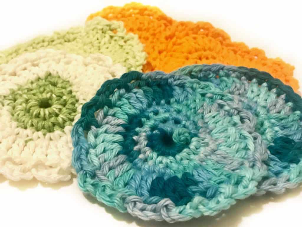Reusable Face Scrubbies are the perfect cotton ball replacer. These eco friendly face pads effectively remove makeup and are great for applying astringent. Save money by washing them again and again. Facial Scrubbies are easy to make so grab your FREE crochet pattern and have them finished in under 30 minutes. | We Three Shanes