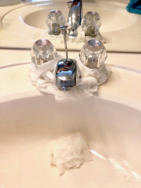 This simple cleaning hack will get rid of stubborn hard water stains from around your faucets and fixtures with ease. Only two household products needed! | We Three Shanes