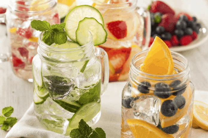 Summer Love Watermelon Mint Lemon Water is a refreshing way to stay hydrated this Summer. Check out this recipe and 16 other Flavored Water Recipes by clicking the link! | We Three Shanes