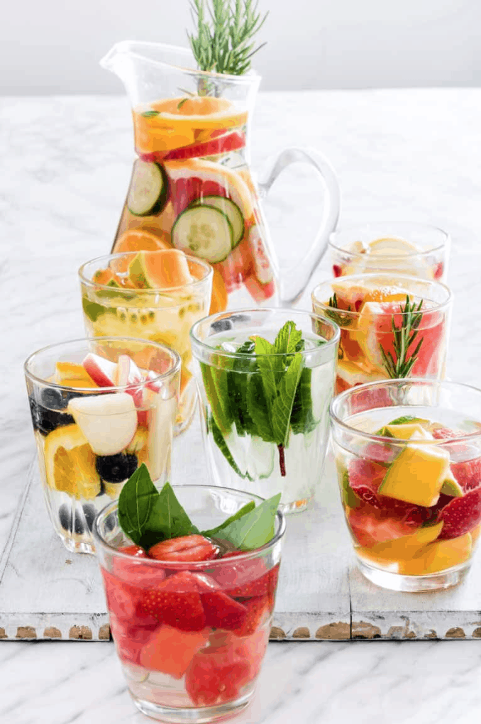 Enjoy water more by infusing it with your favorite fruits, veggies, herbs, and spices. We've got 17 delicious Naturally Flavored Water Recipes for you try. It's the perfect Summer treat. Stay Hydrated!