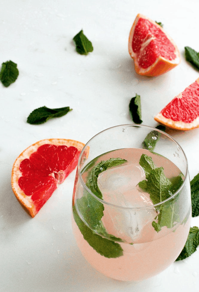 Grapefruit Mint Infused Water is a refreshing way to stay hydrated this Summer. Check out this recipe and 16 other Flavored Water Recipes by clicking the link! | We Three Shanes