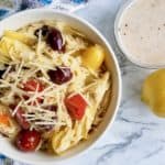 Orzo Pasta Salad is an easy dish to put together for a crowd. Lemon and garlic flavors work perfectly with the orzo pasta, kalamata olives, artichoke hearts. Delicious summer flavors!