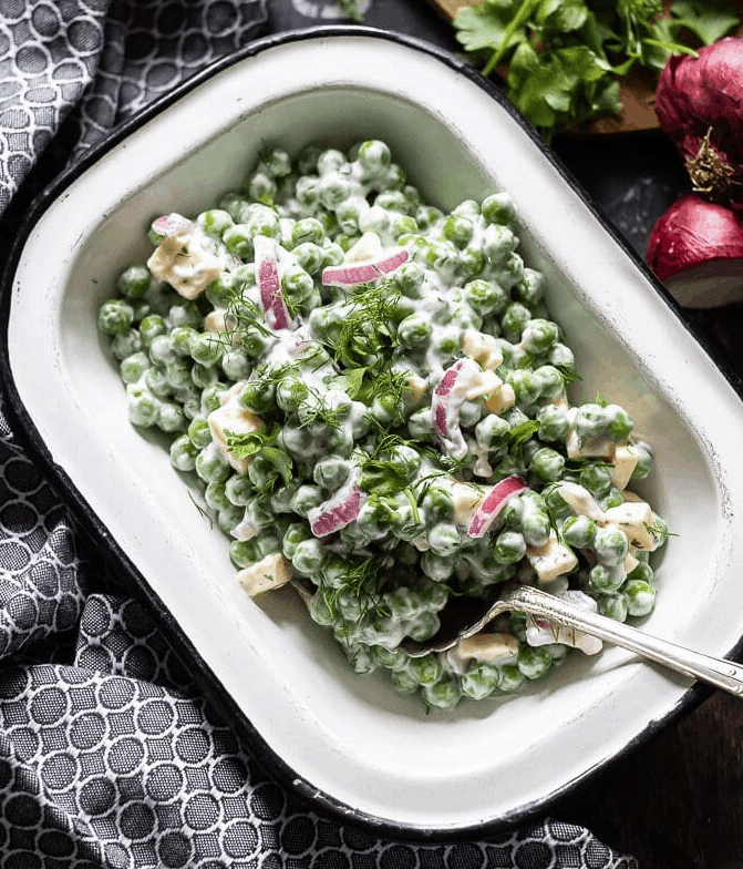 Creamy pea salad recipe that uses frozen peas to make a quick flavorful dish. | We Three Shanes