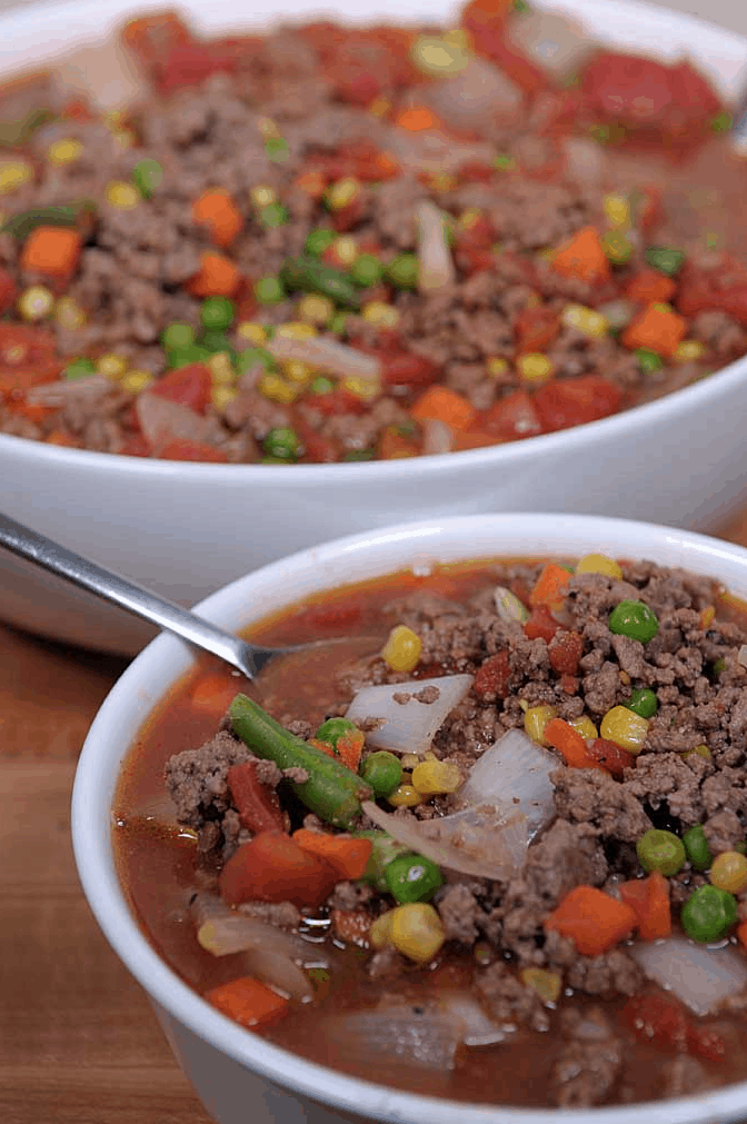 Hamburger soup is a great way to feed families on the cheap. A quick meal when using frozen veggies but still full of flavor and nutrition. | We Three Shanes