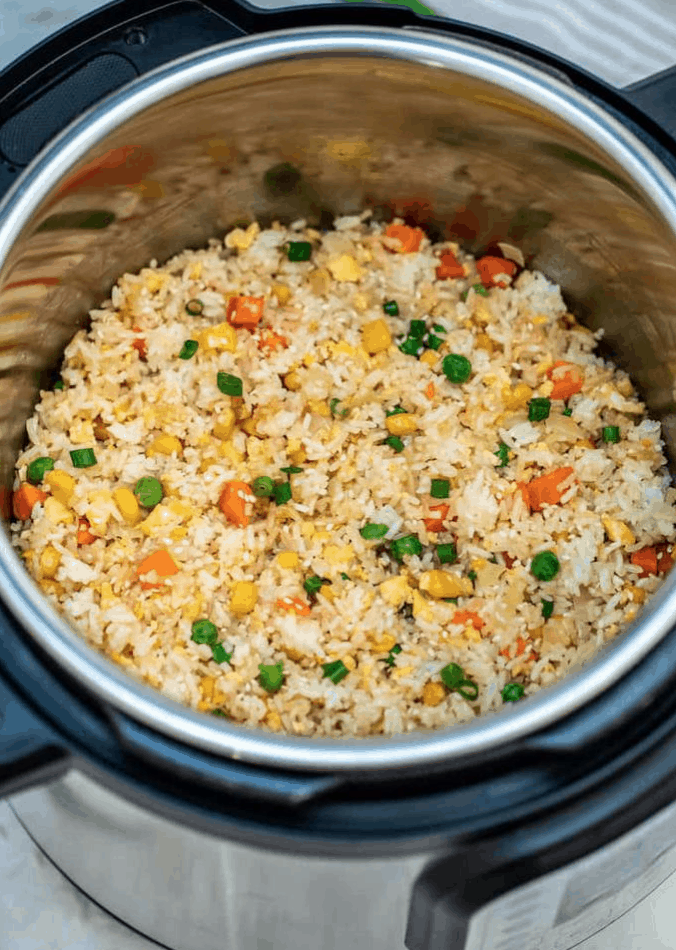 This instant pot Hibachi Fried Rice is a quick and tasty way to use up leftovers and frozen vegetables. | We Three Shanes