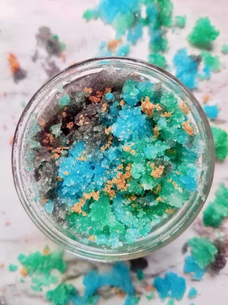 This DIY Mermaid Sugar Scrub Recipe leave skin feeling silky smooth for way less than store bought scrubs. It's a fun easy project that makes a great gift too! | We Three Shanes