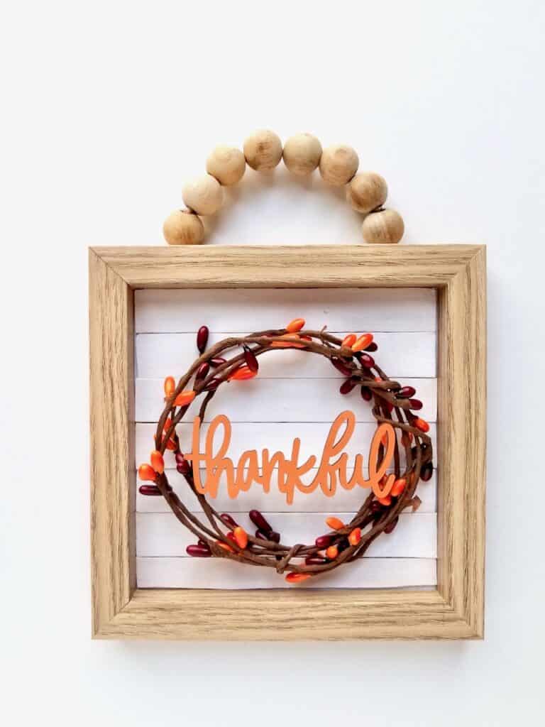 Make this adorable farmhouse wood Bead sign using Dollar Tree supplies. | We Three Shanes 