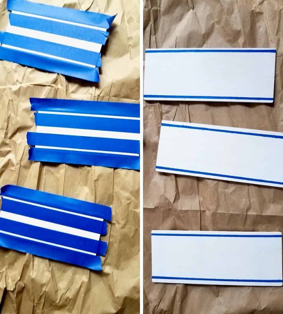 Painting dollar tree wood slats white with thin blue stripes to make a DIY wood slat sign.