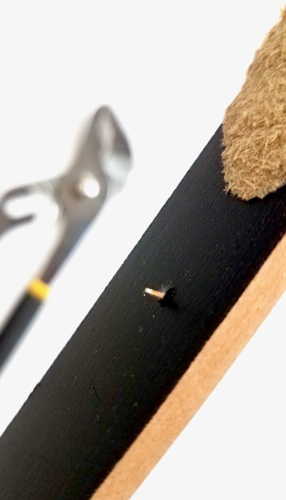 Showing your how to remove a nails left in the stick using pliers.