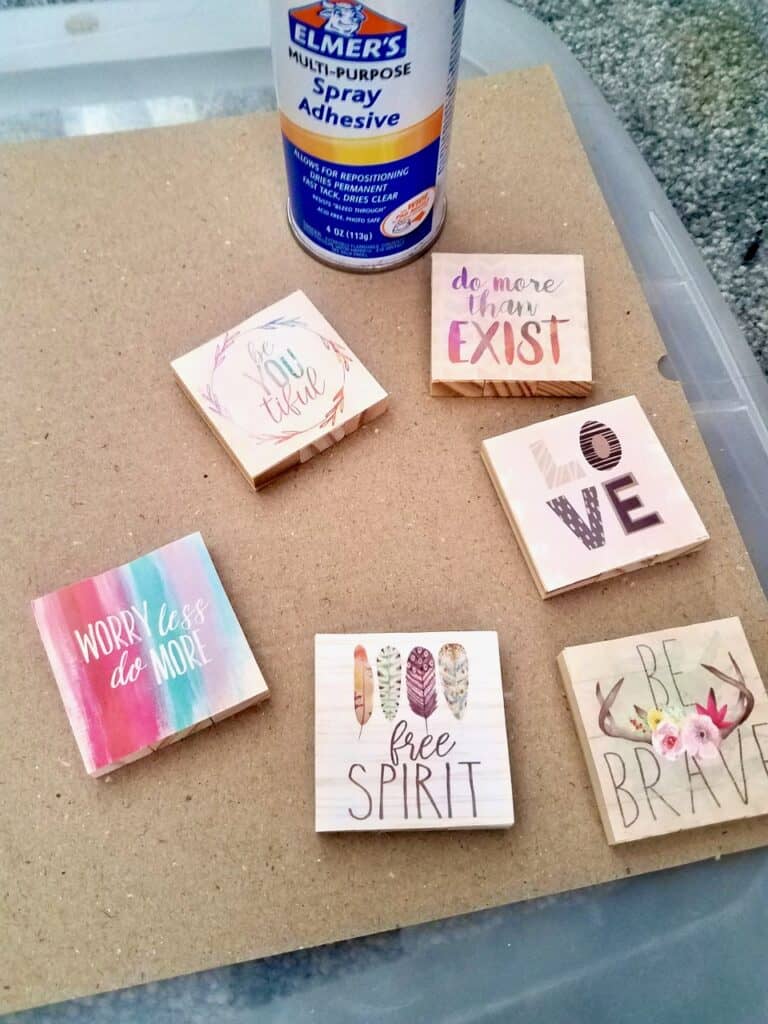 These Dollar Tree jenga wood blocks are glued together to make the cutest magnets using the squares from the backs of calendars. | We Three Shanes