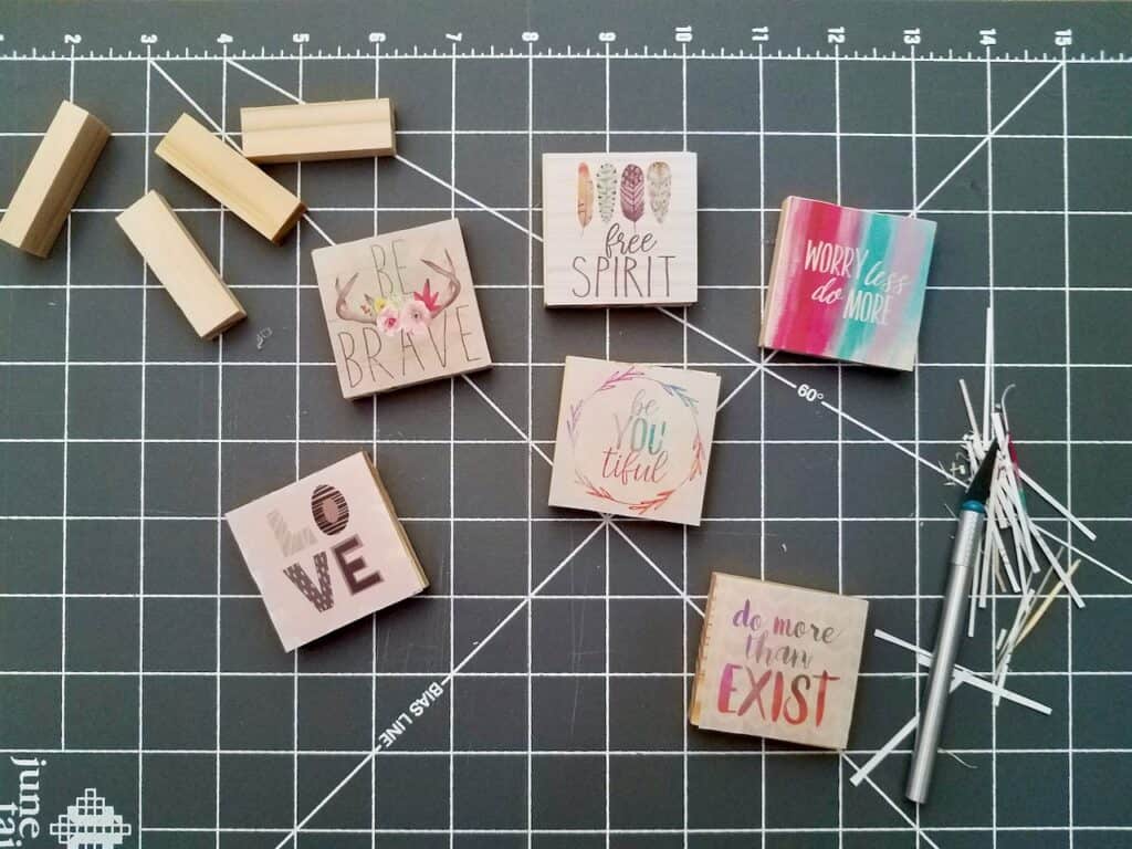Use Dollar Tree jenga blocks and calendars to make the cutest magnets and ornaments. A super easy craft that makes great DIY gifts.