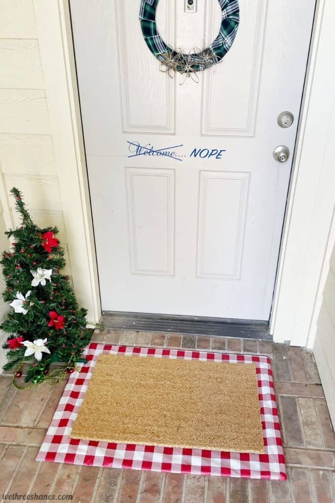 Make your own Interchangeable Layered Doormat for your front porch. It's an inexpensive way to add cute, seasonal decor to your front porch. | We Three Shanes