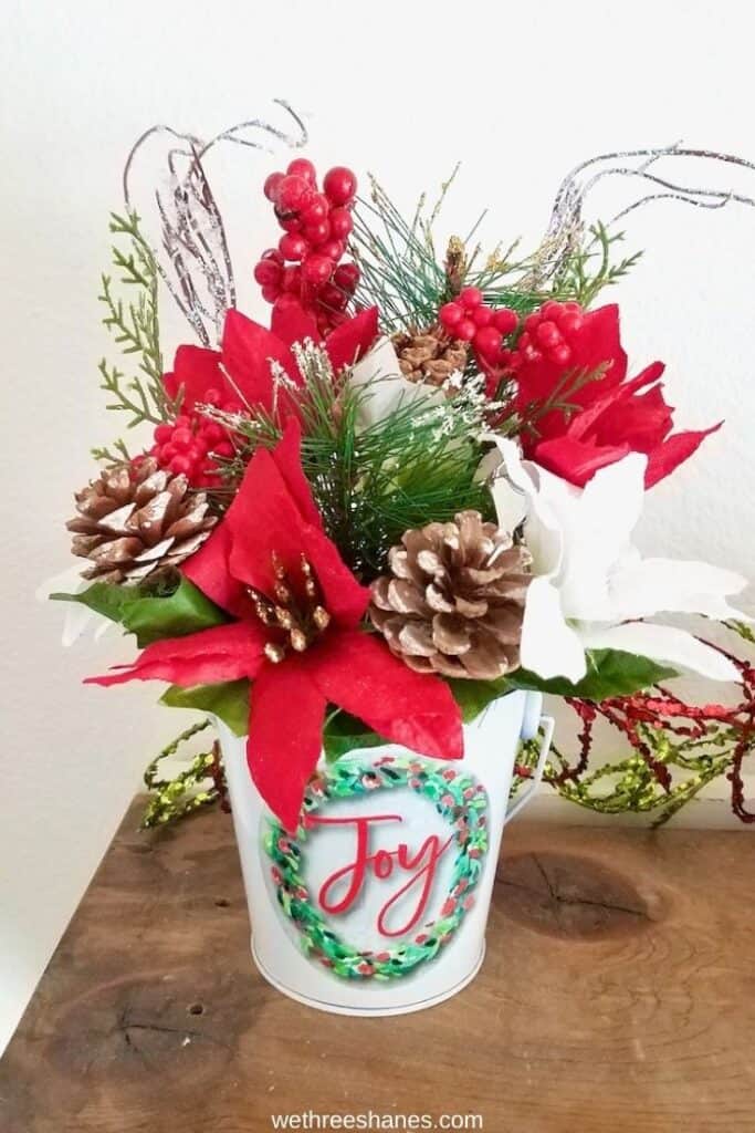 It's easier than you think to make your own Christmas floral arrangements. Customize the holiday decor while saving money! | We Three Shanes