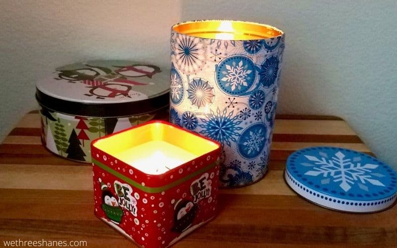 Learn how to make Christmas Tin Candles using supplies from the Dollar Tree. They make a great addition to holiday decor or give them away for a fun DIY gift. | We Three Shanes
