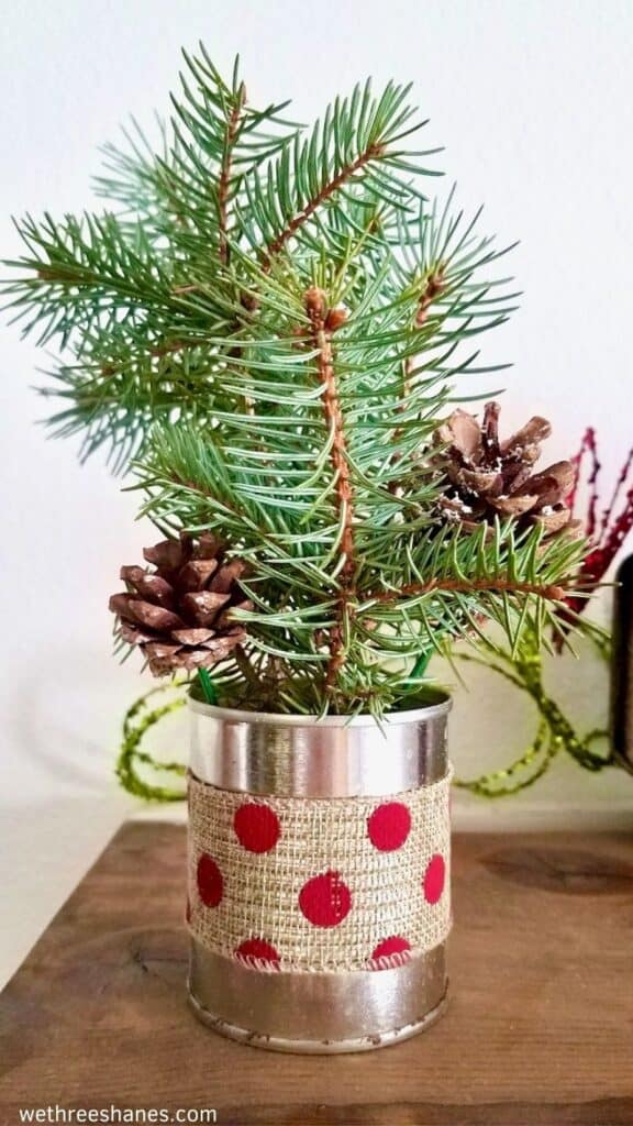 Make this simple Christmas arrangement craft with items from around the house. It's a cute addition to your holiday decor. | We Three Shanes 