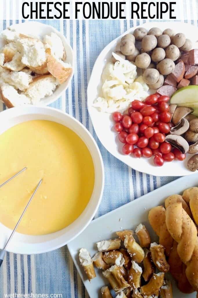 Make this family friendly Cheddar Cheese Fondue Recipe as a fun party snack, date night at home, or family dinner for a special occasion. | We Three Shanes