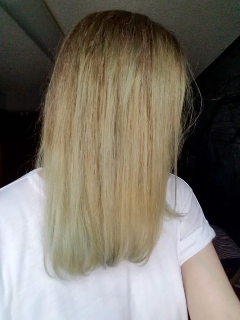 A side view of my hair after using OvertoneVibrant Silver shows very blotchy hair with streaks of green/grey color in different parts of my hair especially at the ends. Lots of blonde hair with no color deposited.