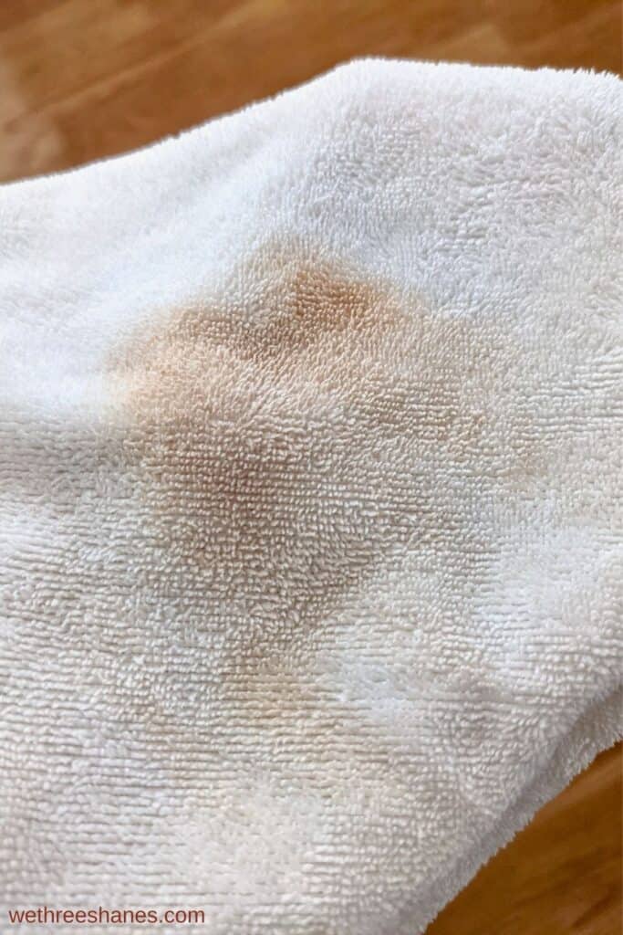 Microfiber clean cloth in white with makeup smudges on it.