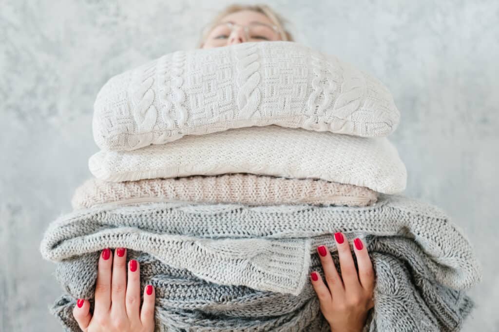 Warm cozy blankets in neutral colors are a must for creating a cozy home.