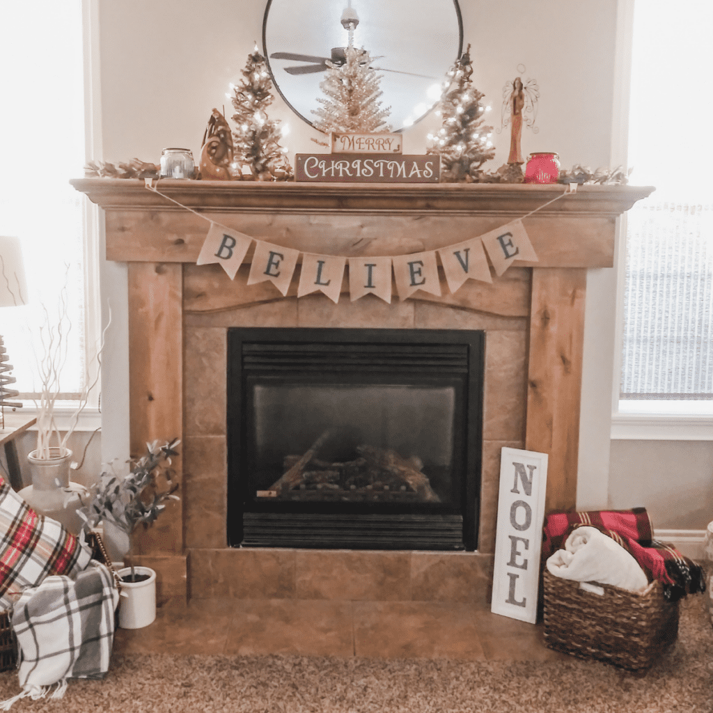 Cozy plaid blankets from Amazon in baskets by a fireplace. 