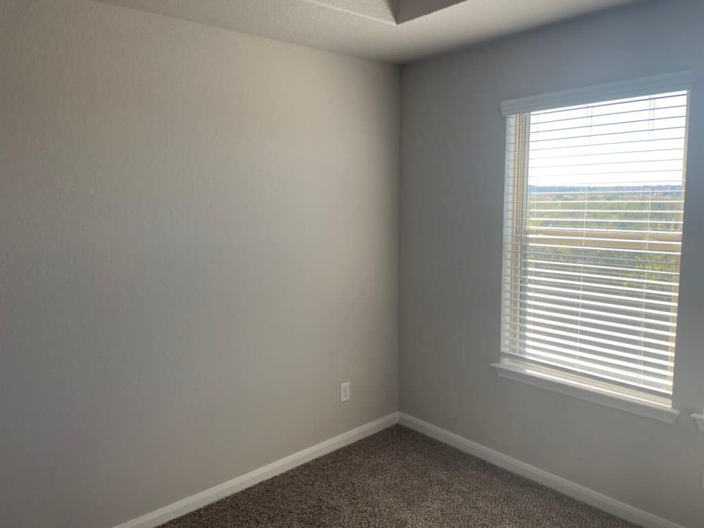 Blank wall to the left or a window in an empty room