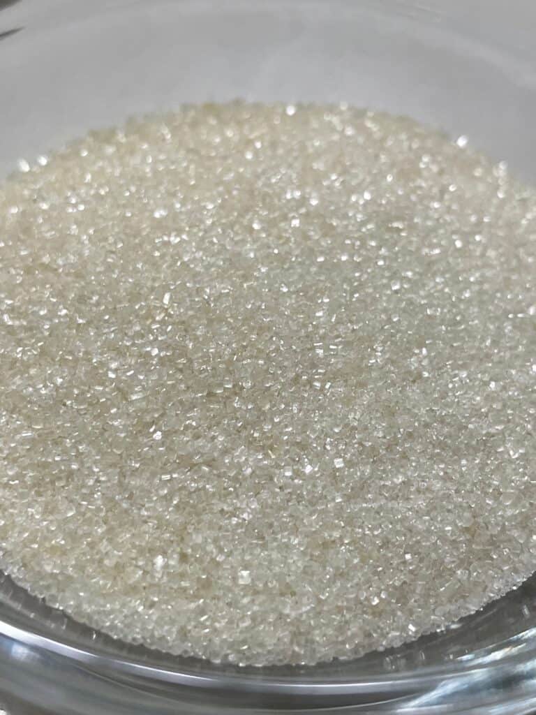 close up picture of a bowl of sugar