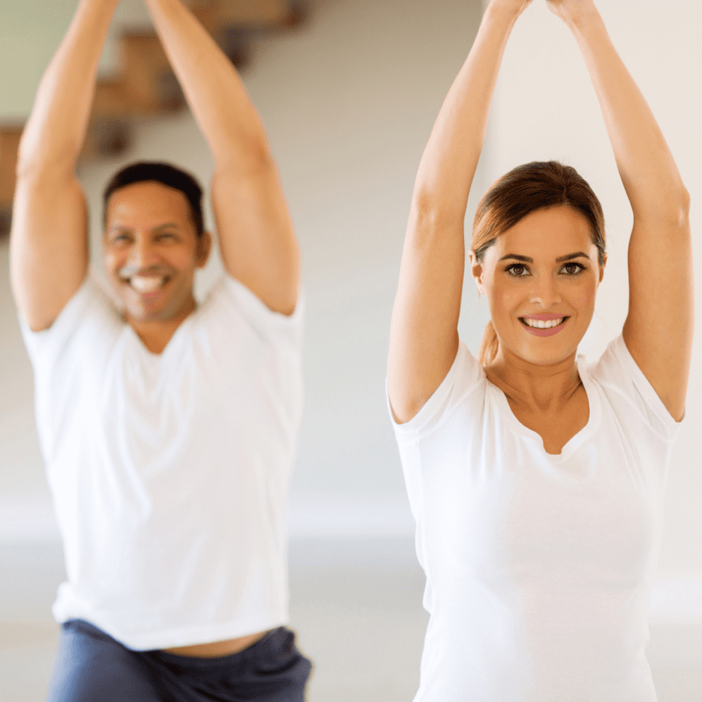 Couple does yoga at home on date