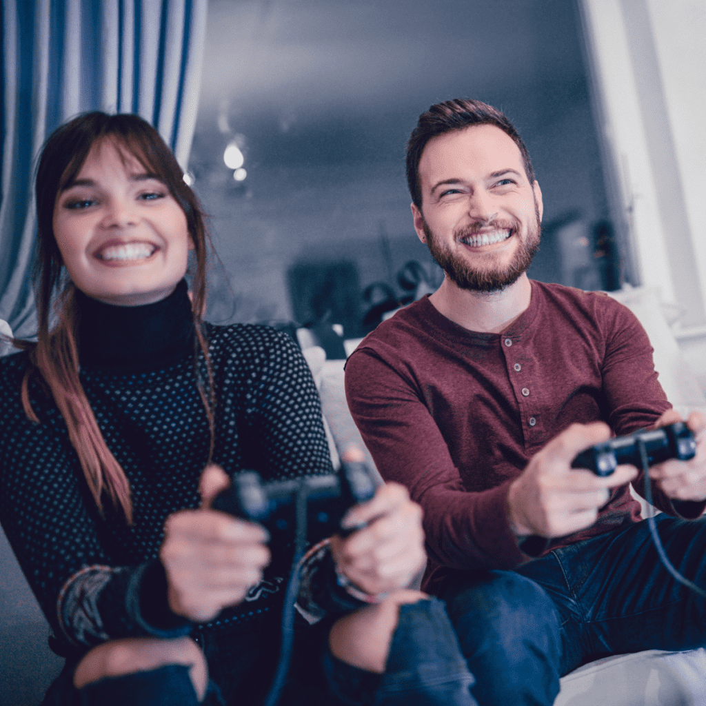 Couple playing video games together during an at home date.