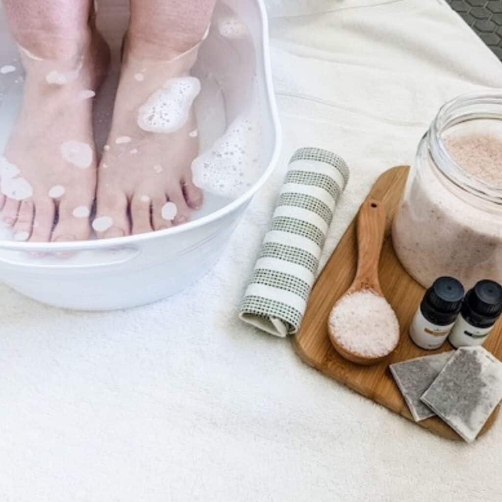A DIY Foot Soak can get rid of dry, cracked heels, soften calluses, eliminate foot fungus, relax tired, achy feet and more. There are tons of benefits to this self-care treatment. | We Three Shanes