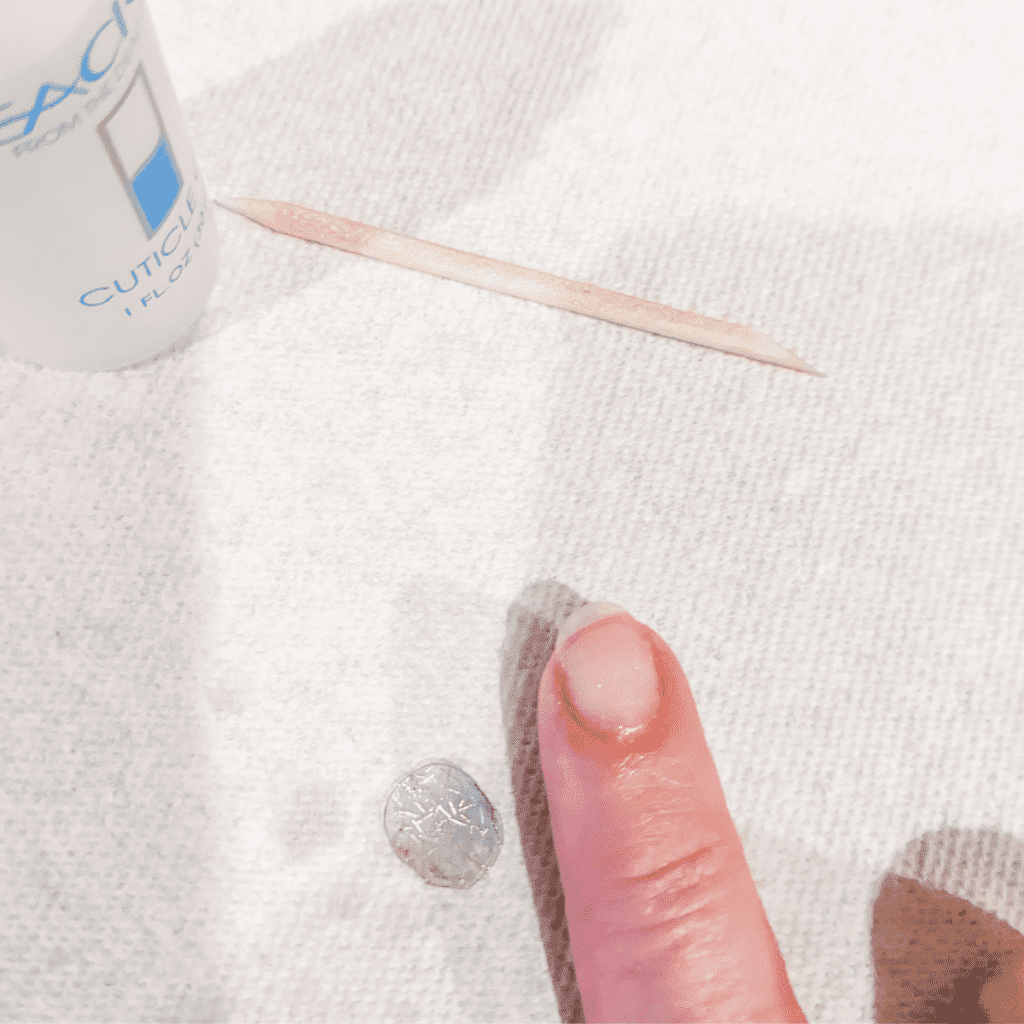 Removing Dashing Diva Glaze with cuticle oil and the provided stick.