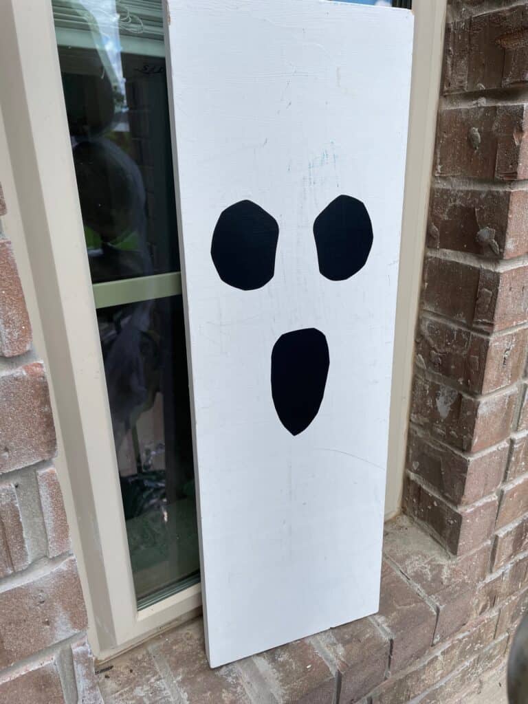 A piece of wood painted to look like a ghost