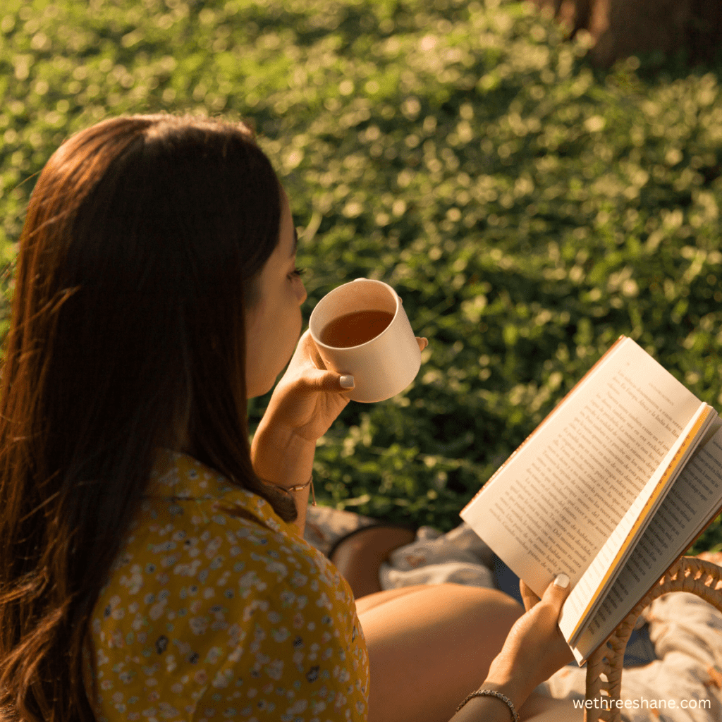 A woman enjoying a book on a nice day. If you need a book to read, try one from our list of the 10 best simple living books.