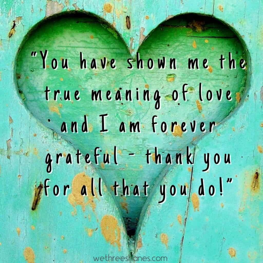 Green blue painted wood with a carved heart out of it. With a Grateful for him message.