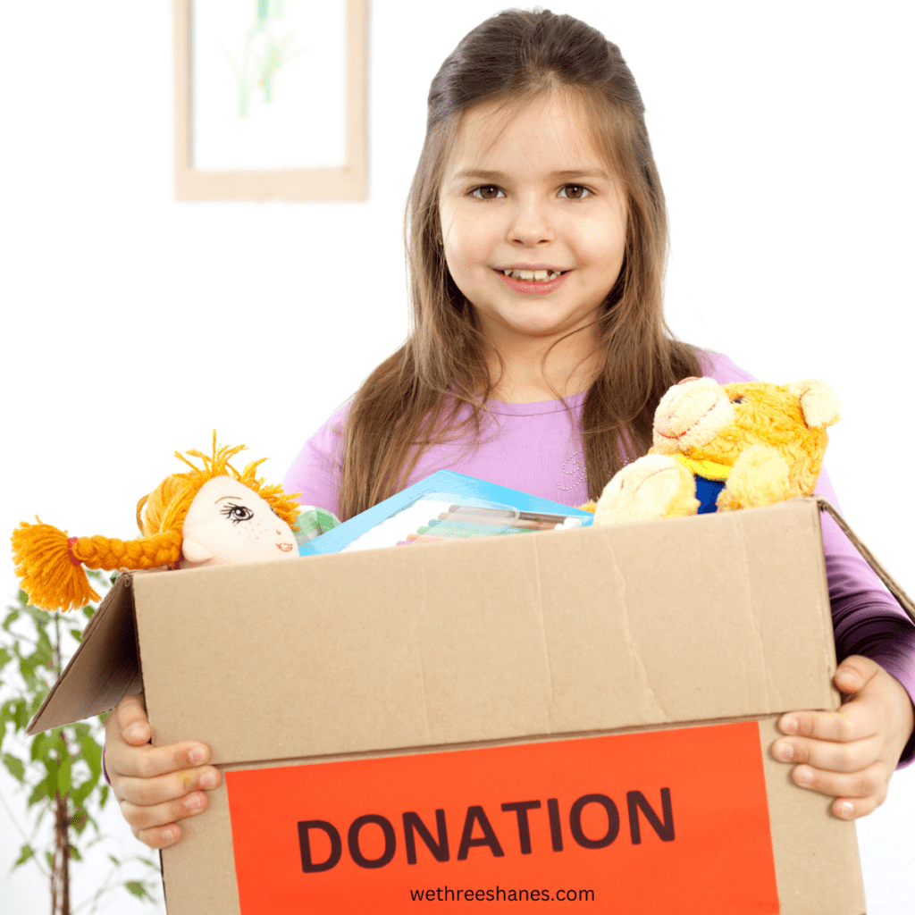 A little girl donates the items she has declutterd while practicing minimalism as a family.