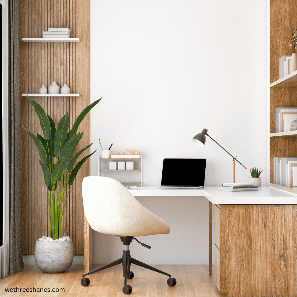 A beautiful minimal home office using natural woods and whites. Clean, stress-free spaces like this can be achieved when you are practicing minimalism with a family.