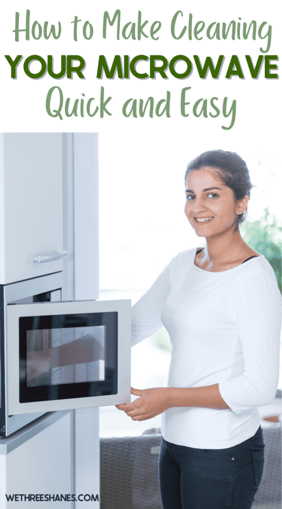 Woman cleaning her microwave.