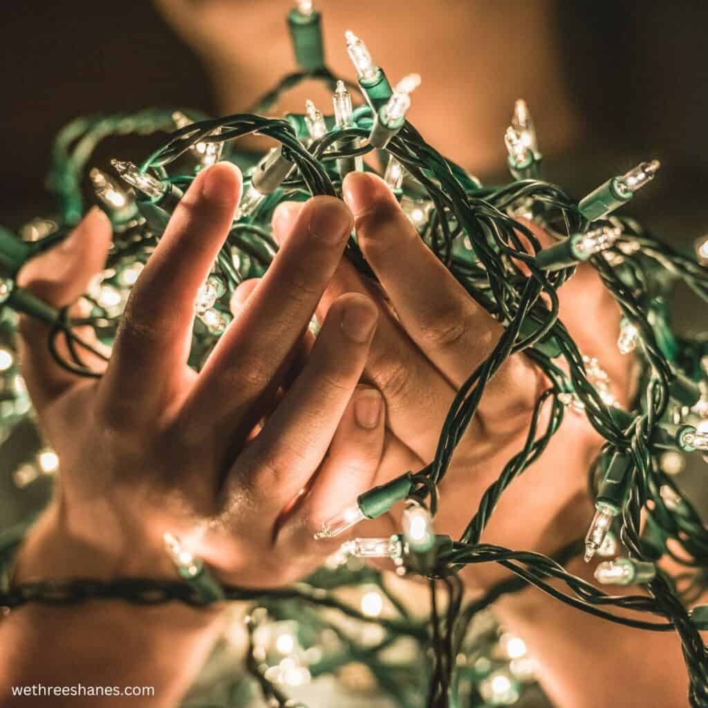 Christmas lights in cupped hands