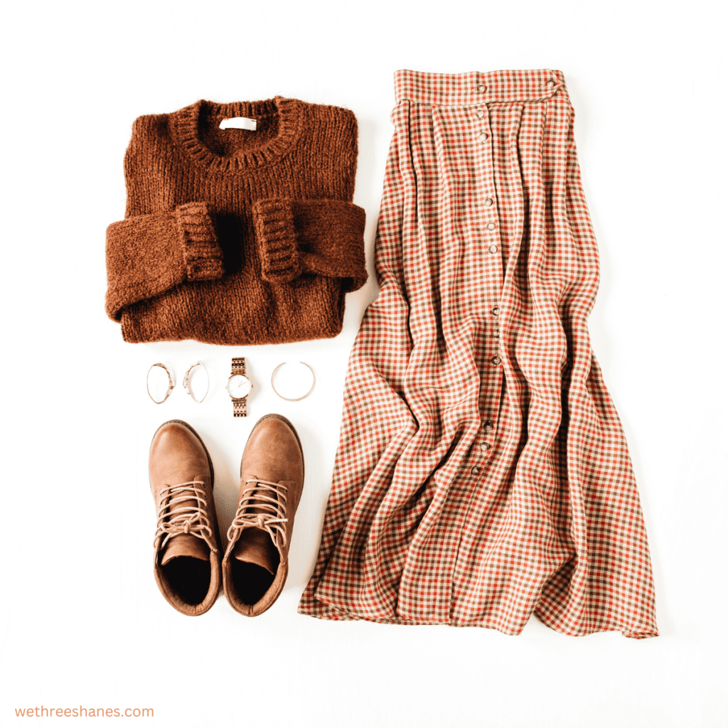 Flowing skirt, chunky sweater, and brown ankle boots just one possibility with a minimalist fall wardrobe.