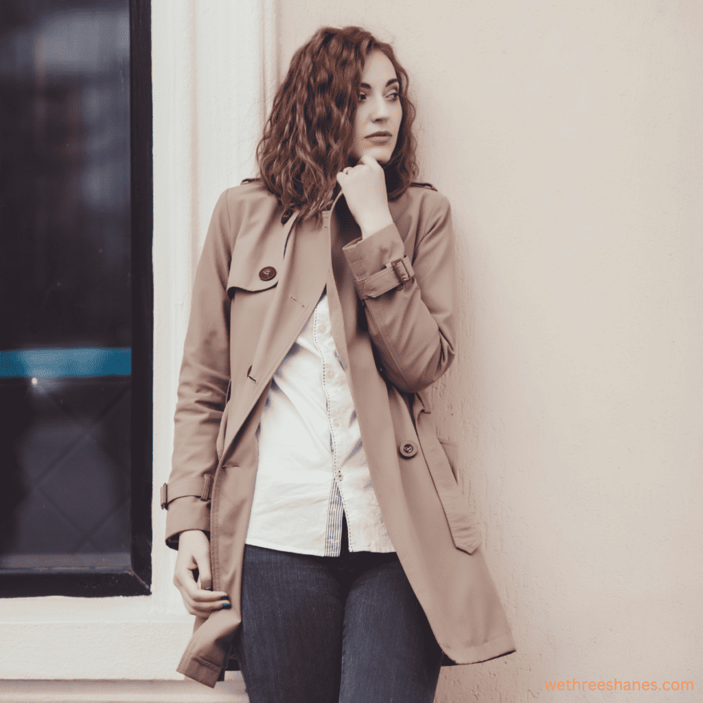 A trench coat with a white button down in a classic pairing for fall weather in your minimalist fall wardrobe.