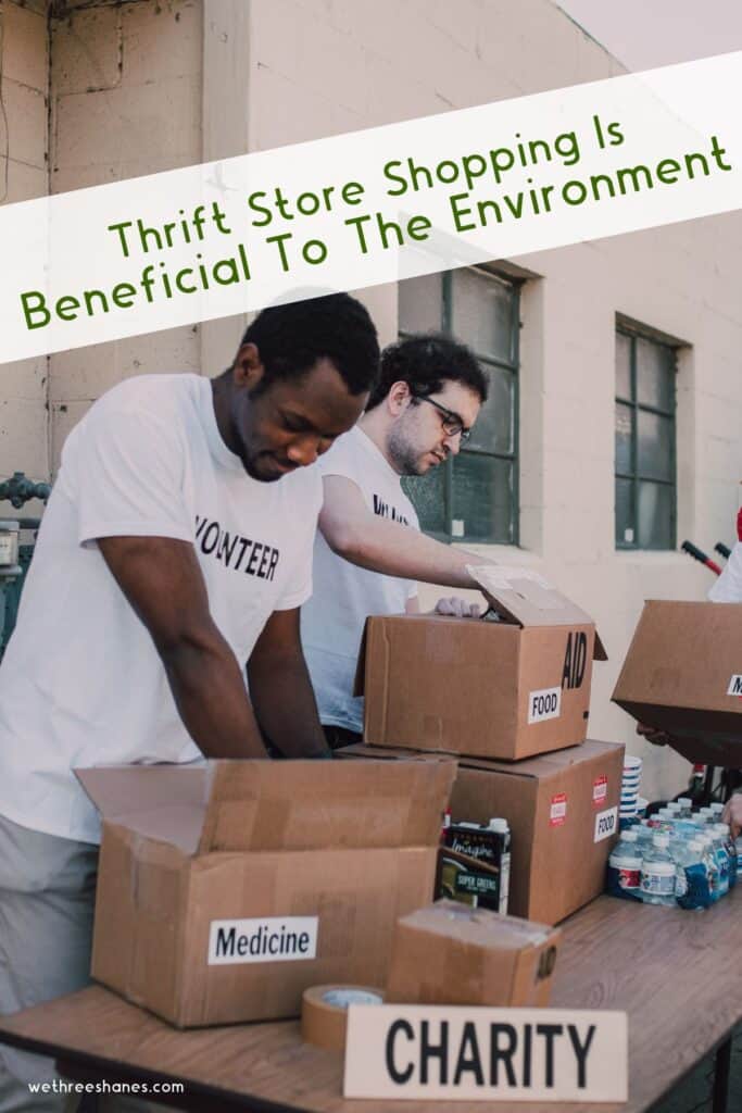 Two adult males sorting donated items for charity.