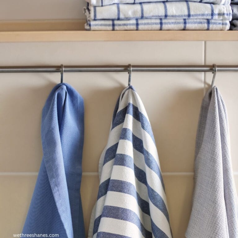 dish towels hanging on a hook to dry