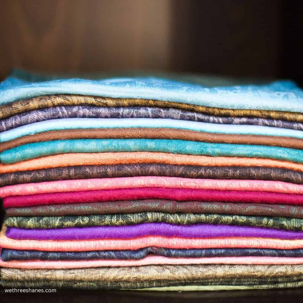 a stack of colorful, stacked scarves